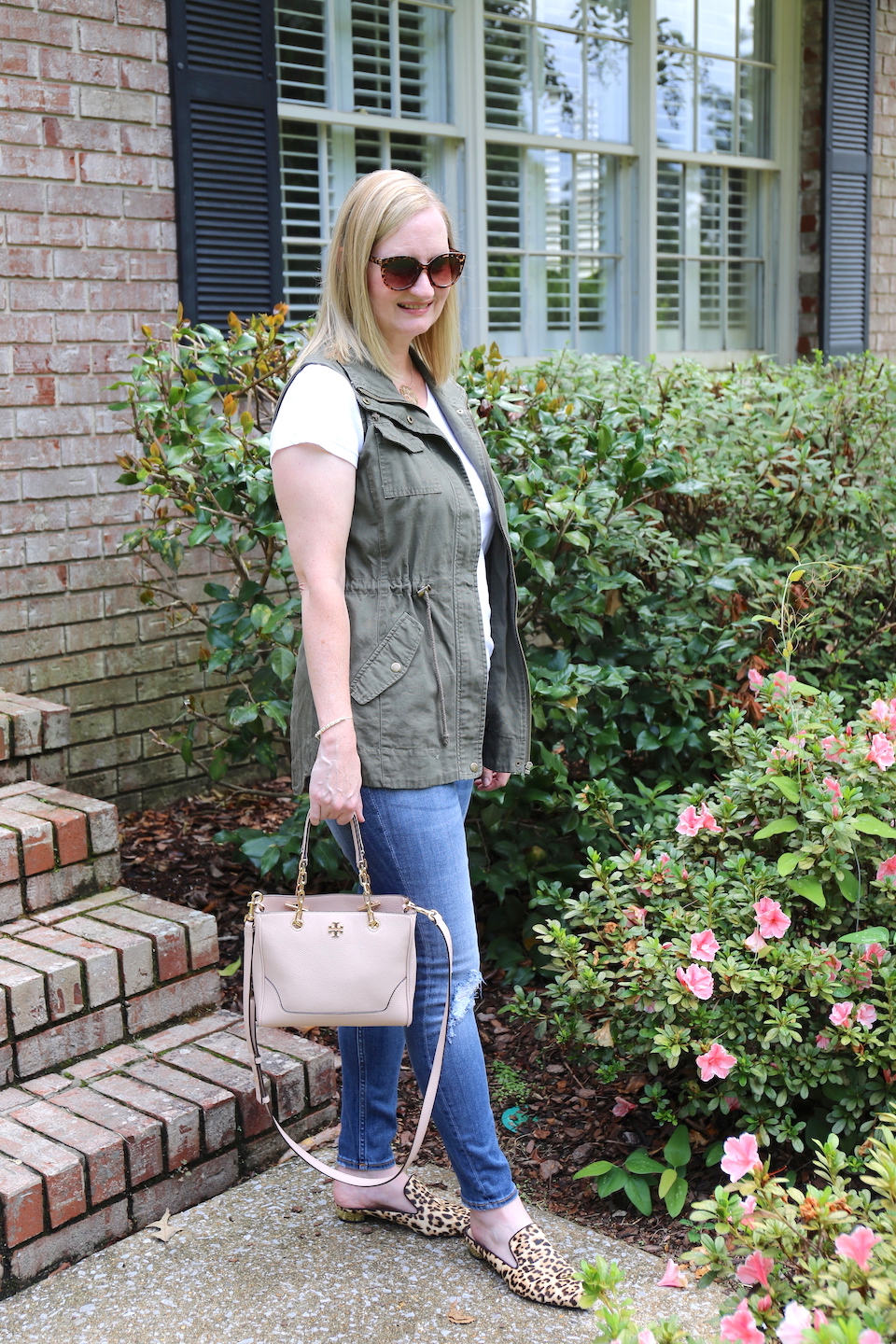 Olive Leopard and Blush - This fall outfit includes a white tee, olive utility vest, distressed jeans, blush satchel bag and leopard mules