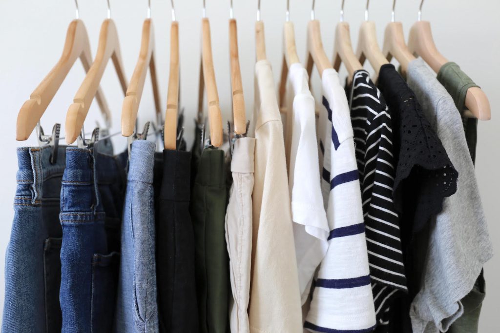 Travel Capsule Wardrobe On a Clothes Rack Closeup