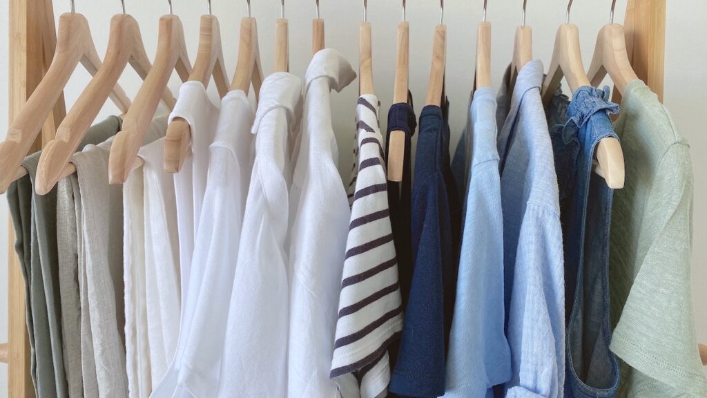 MY 25 PIECE COASTAL NEUTRAL COLOR CAPSULE WARDROBE SUMMER 2022 - clothes rack closeup