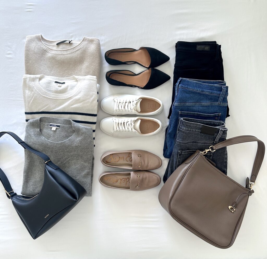 SWEATERS MIX AND MATCH COOL TONES FLATLAY WITH HANDBAGS