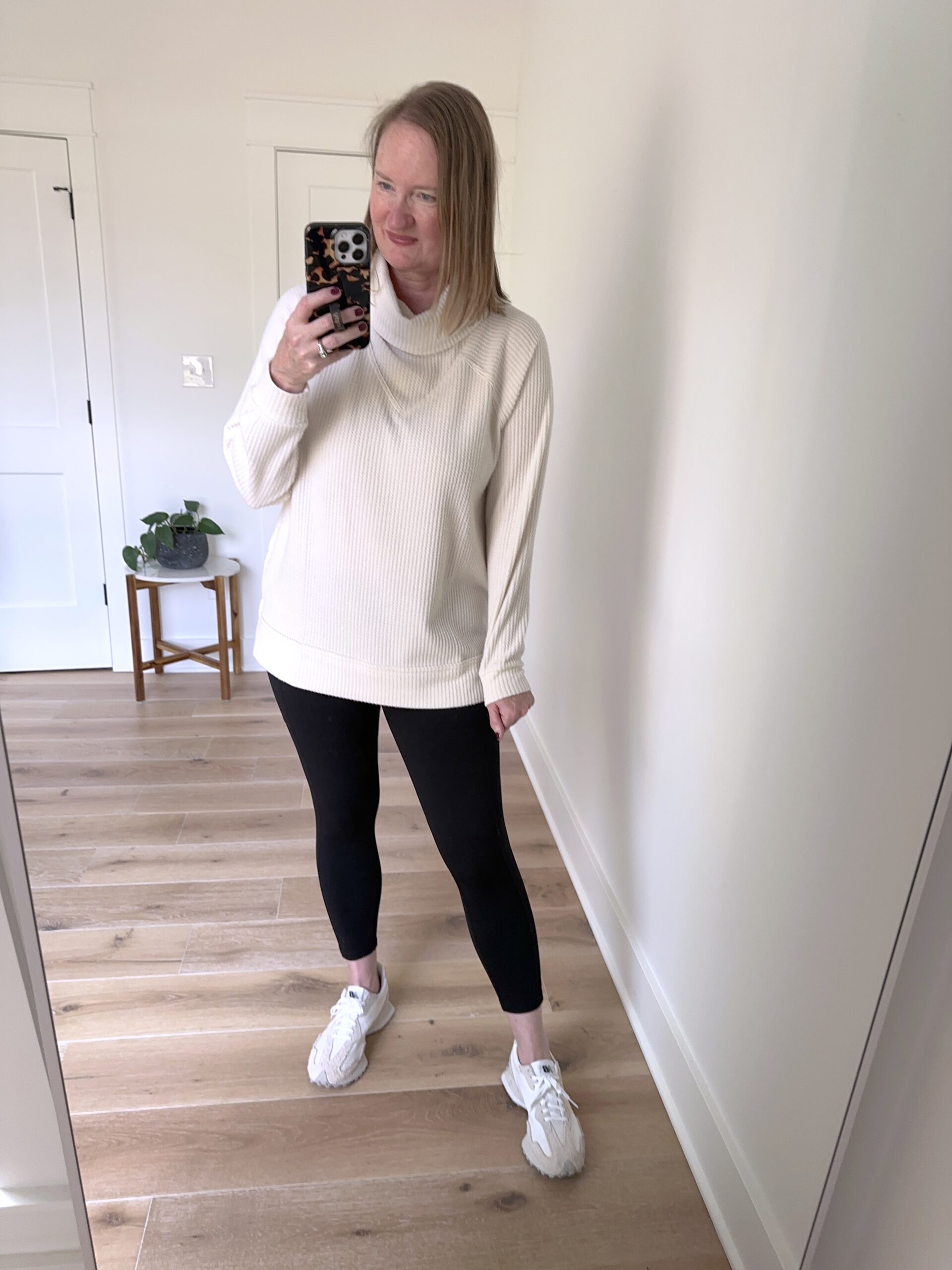 https://classyyettrendy.com/wp-content/uploads/2023/10/TRY-ON-SESSION-OCT-2023-Lou-Grey-Wafflestitch-Cowl-Neck-Tunic-Black-Ponte-Pocket-Leggings-New-Balance-327-Sneakers-1a-scaled.jpg